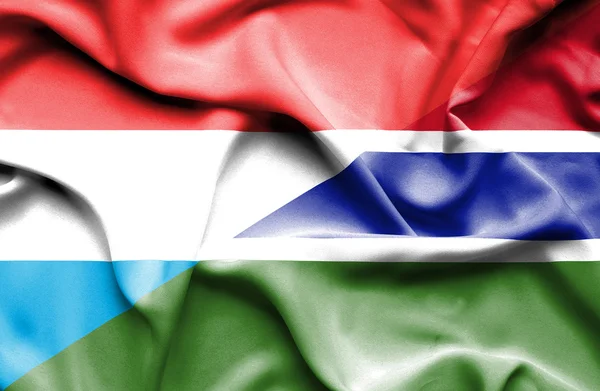 Waving flag of Gambia and Luxembourg — Stock Photo, Image