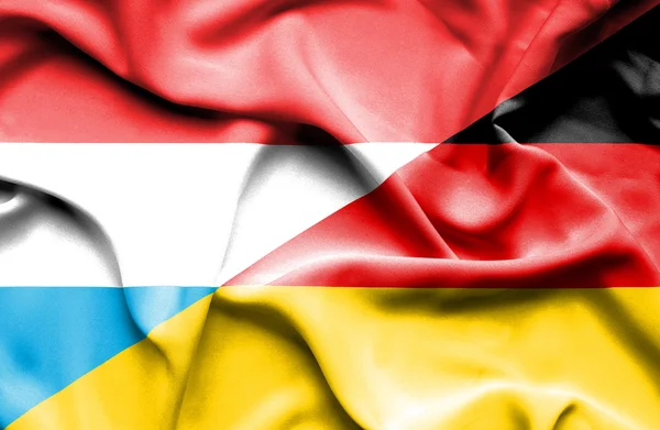 Waving flag of Germany and Luxembourg — Stock Photo, Image
