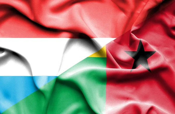 Machać flaga Gwinei Bissau i Luksemburg — Zdjęcie stockowe