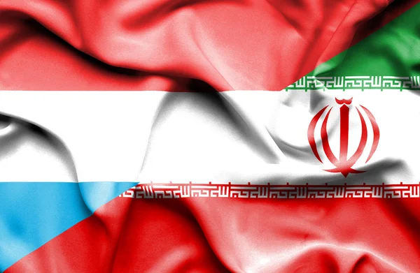 Macha flagą Iran i Luksemburga — Zdjęcie stockowe