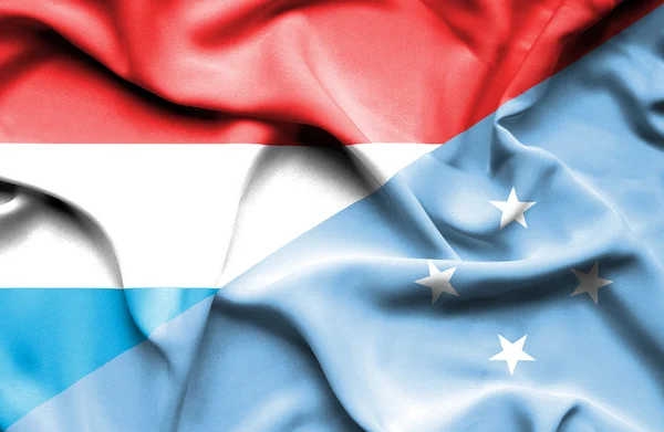 Wapperende vlag van Micronesia en Luxemburg — Stockfoto
