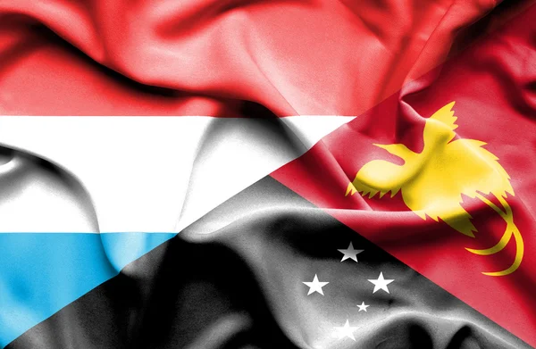 巴布亚新几内亚和卢森堡那飘扬的旗帜 — 图库照片