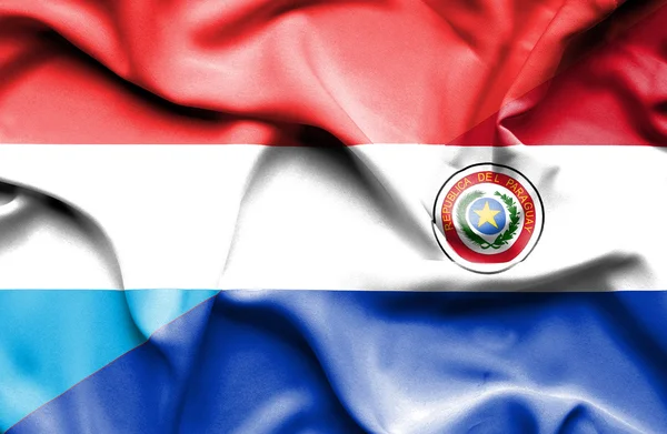 Waving flag of Paraguay and Luxembourg — Stock Photo, Image