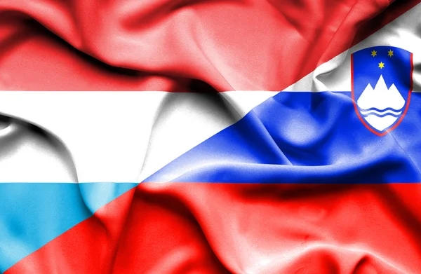 Waving flag of Slovenia and Luxembourg — Stock Photo, Image