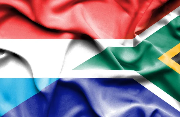 Mávání vlajkou Jihoafrické a Lucembursko — Stock fotografie