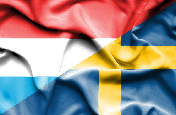 Bandiera sventolante di Svezia e Lussemburgo — Foto Stock