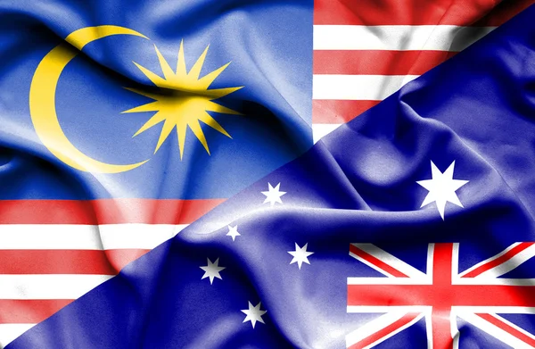 Κουνώντας τη σημαία της Αυστραλίας και της Μαλαισίας — Φωτογραφία Αρχείου