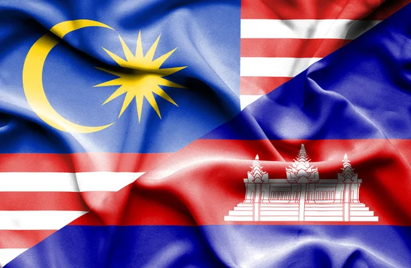 Waving flag of Cambodia and Malaysia — Stock Photo, Image