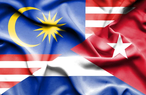 Waving flag of Cuba and Malaysia — Stock Photo, Image