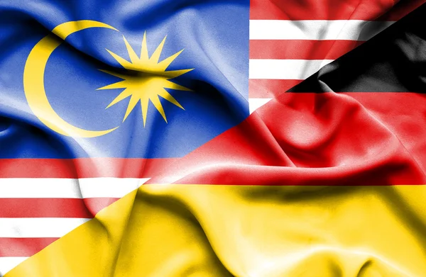Waving flag of Germany and Malaysia — Stock Photo, Image