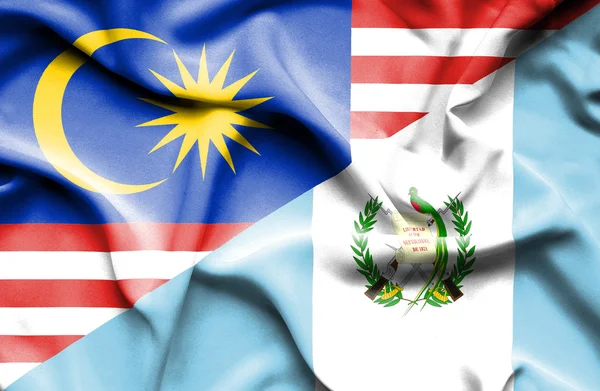Bandiera sventolante di Guatemala e Malesia — Foto Stock