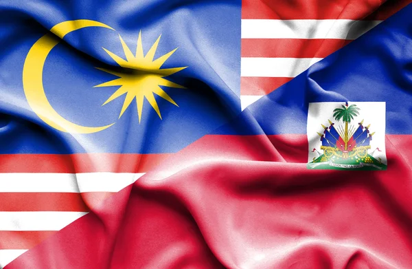 Waving flag of Haiti and Malaysia — Stock Photo, Image