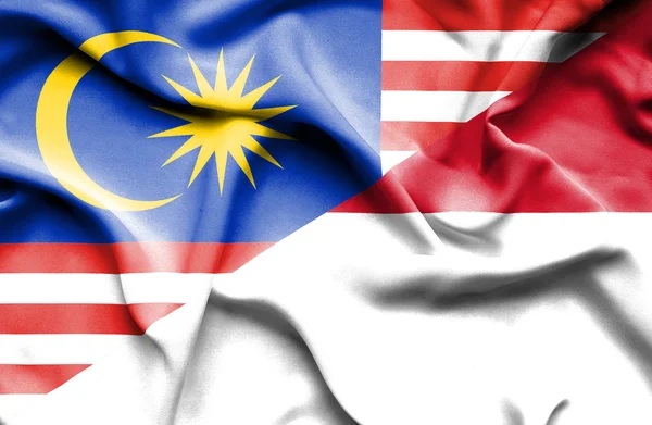 Waving flag of Indonesia and Malaysia — Stock Photo, Image