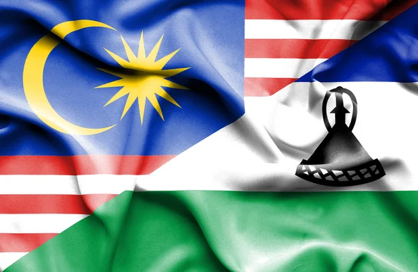 레소토와 말레이시아의 국기를 흔들며 — 스톡 사진