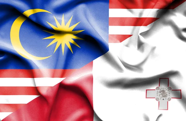 Bandiera sventolante di Malta e Malaysia — Foto Stock