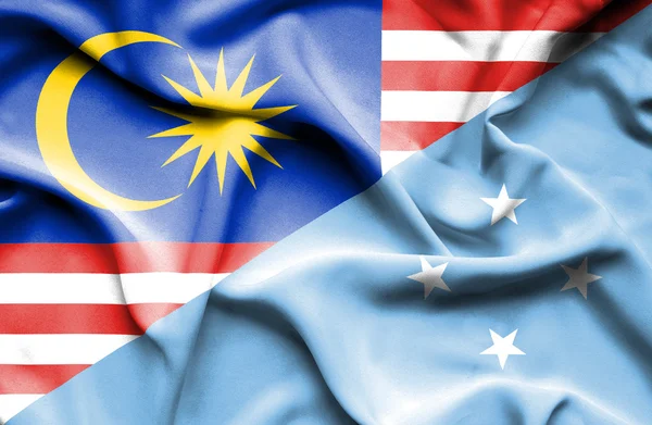 Waving flag of Micronesia and Malaysia — Stock Photo, Image