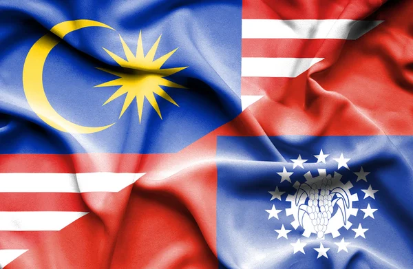 Macha flagą Myanmar i Malezji — Zdjęcie stockowe
