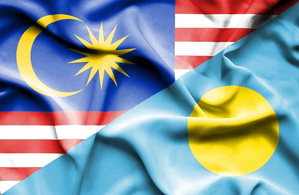 Waving flag of Palau and Malaysia — Stock Photo, Image