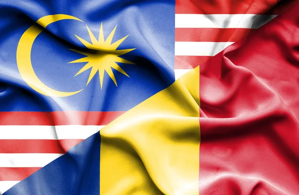 Waving flag of Romania and Malaysia — Stock Photo, Image