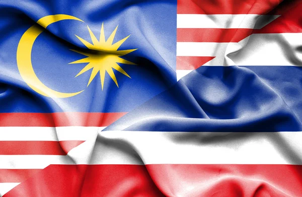 Waving flag of Thailand and Malaysia — Stock Photo, Image