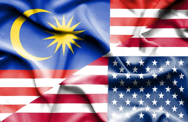 Waving flag of United States of America and Malaysia — Stock Photo, Image