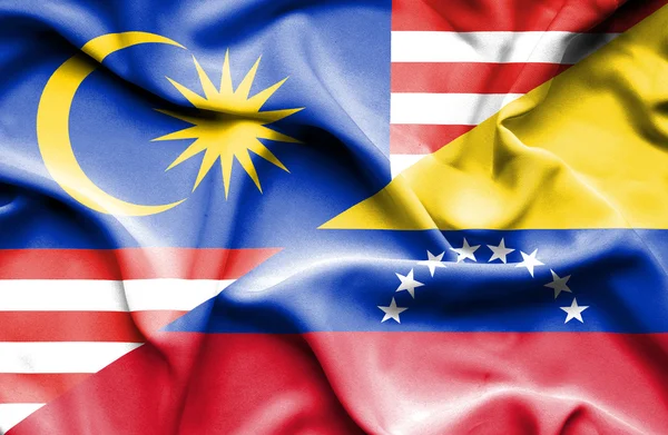 Waving flag of Venezuela and Malaysia — Stock Photo, Image