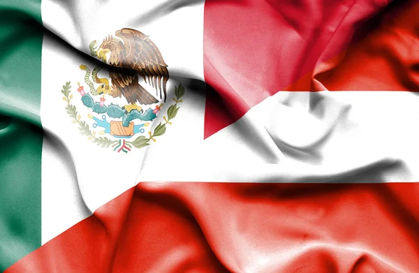 Itävallan ja Meksikon lipun heiluttaminen — kuvapankkivalokuva