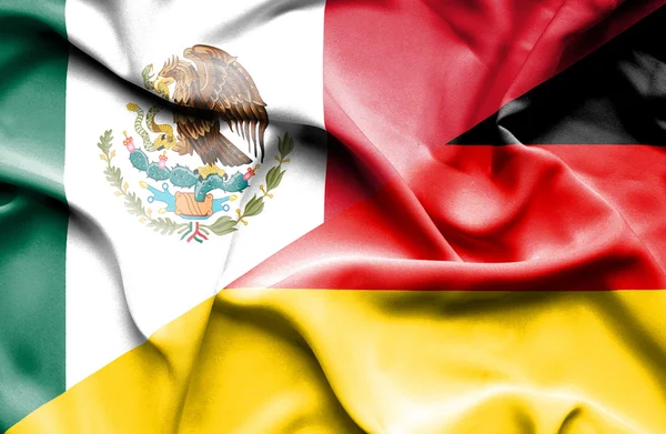 Waving flag of Germany and Mexico — Stock Photo, Image