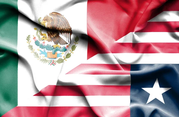 Integetett Libéria és Mexikó zászlaja — Stock Fotó