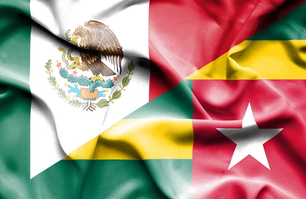 Waving flag of Togo and Mexico — Stock Photo, Image