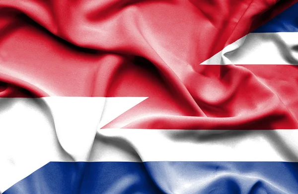 Waving flag of Costa Rica and Monaco — Stock Photo, Image