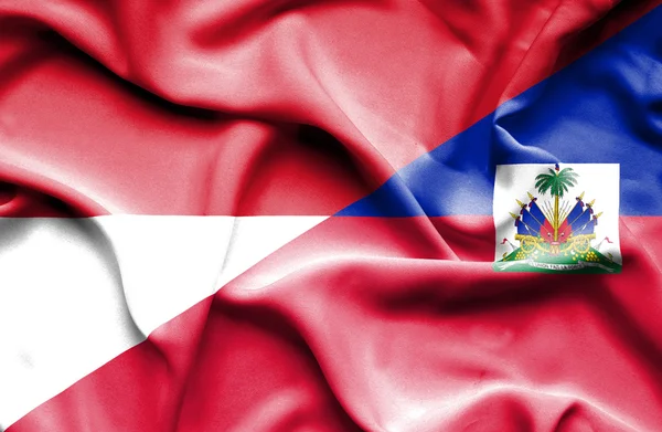 Haiti och Monaco viftande flagga — Stockfoto