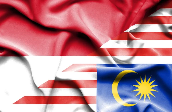 Waving flag of Malaysia and Monaco — Stock Photo, Image