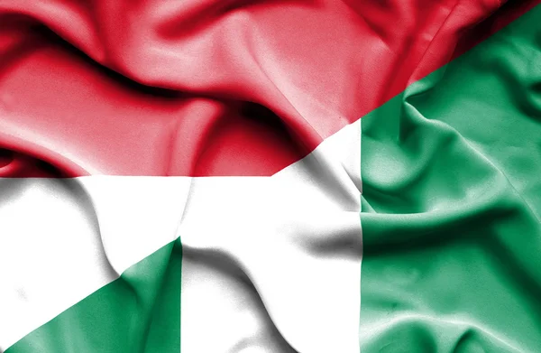 Waving flag of Nigeria and Monaco — Stock Photo, Image