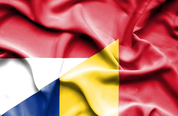 Waving flag of Romania and Monaco — Stock Photo, Image