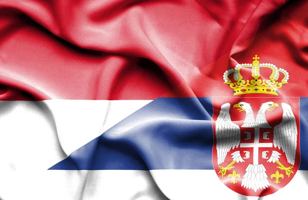 Waving flag of Serbia and Monaco — Stock Photo, Image