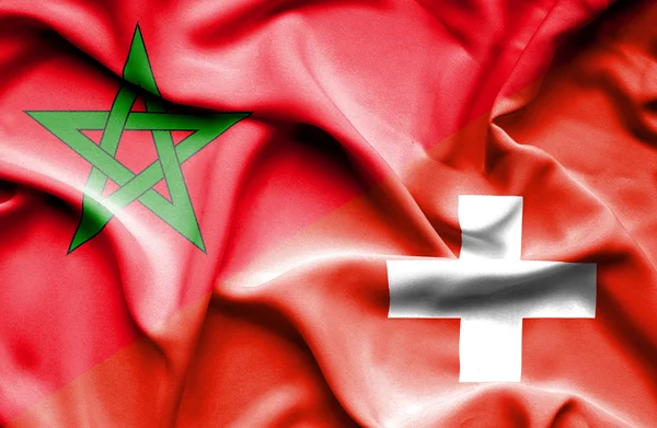 Waving flag of Switzerland and Morocco — Stock Photo, Image