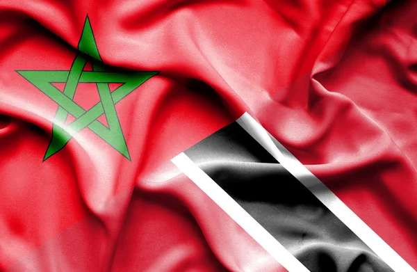 Mávání vlajkou Trinidadu a Tobaga a Maroko — Stock fotografie