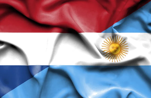 Waving flag of Argentina and Netherlands — Stock Photo, Image