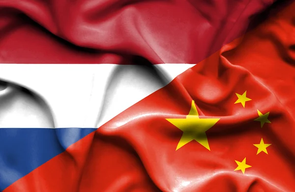 Waving flag of China and Netherlands — Stock Photo, Image