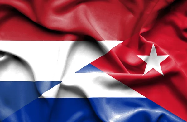 Waving flag of Cuba and Netherlands — Stock Photo, Image