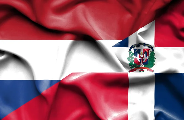 Waving flag of Dominican Republic and Netherlands — Stock Photo, Image