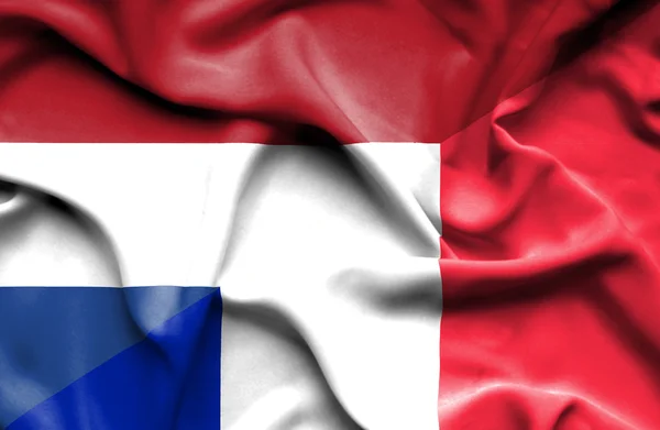 Waving flag of France and Netherlands — Stock Photo, Image