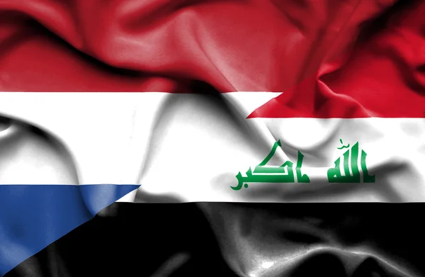 Bandiera sventolante di Iraq e Paesi Bassi — Foto Stock
