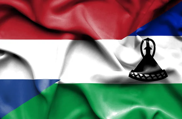 Bandiera sventolante del Lesotho e Paesi Bassi — Foto Stock