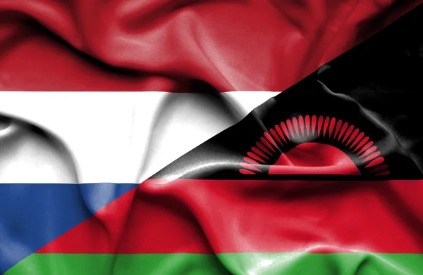 Malawi och Nederländerna viftande flagga — Stockfoto
