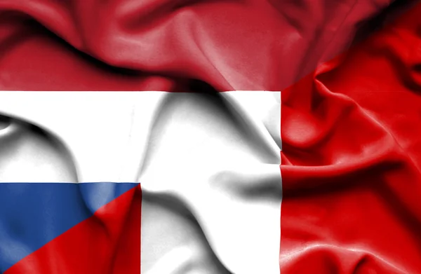 Waving flag of Peru and Netherlands — Stock Photo, Image