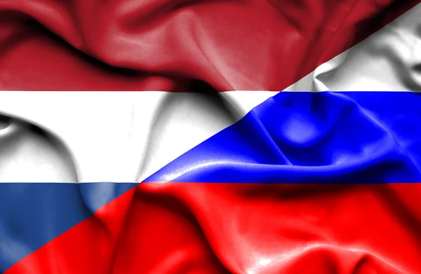 Wapperende vlag van Rusland en Nederland — Stockfoto