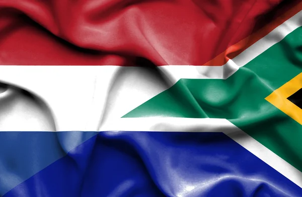 Sydafrika och Nederländerna viftande flagga — Stockfoto