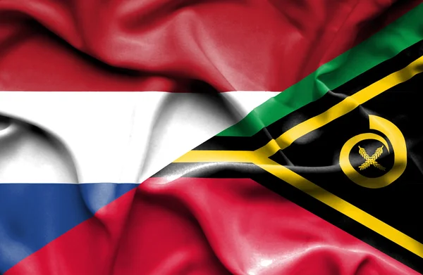 Wapperende vlag van vanuatu en Nederland — Stockfoto